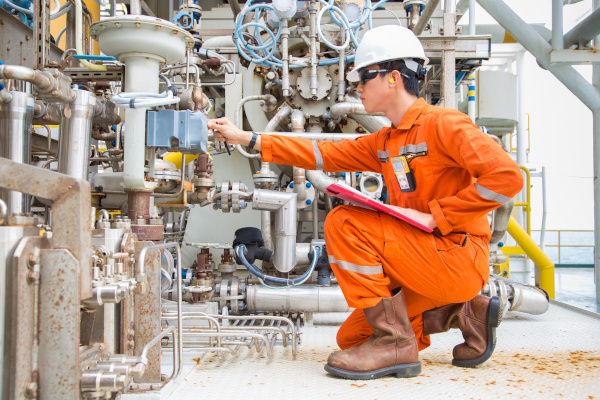 worker inspecting machinery small