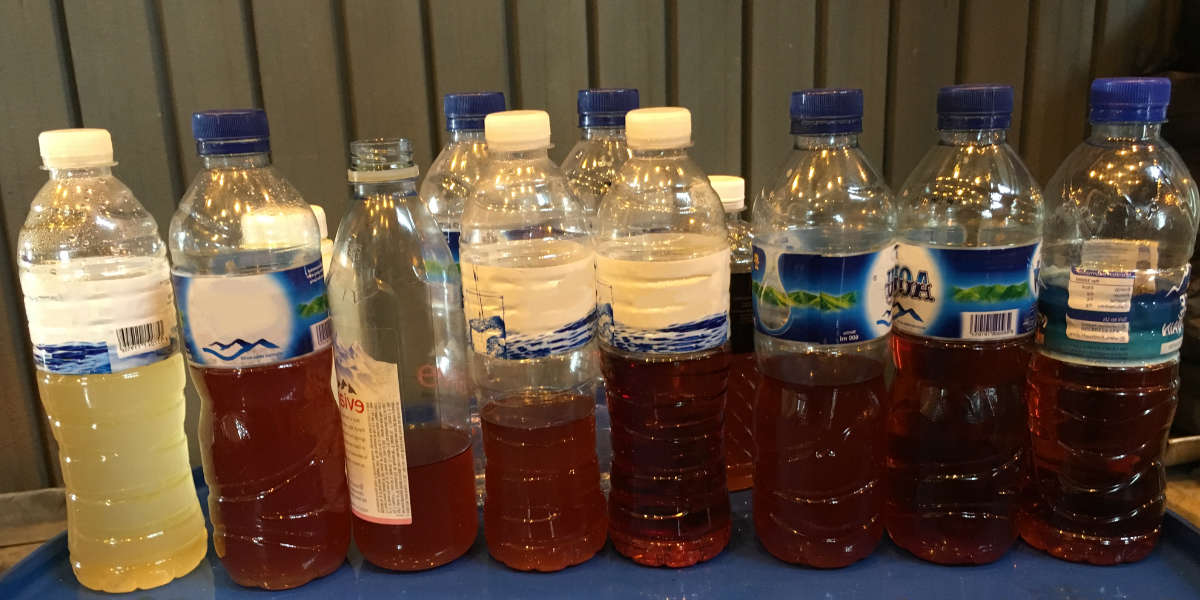 bottles with oil from dirty to clean state 2